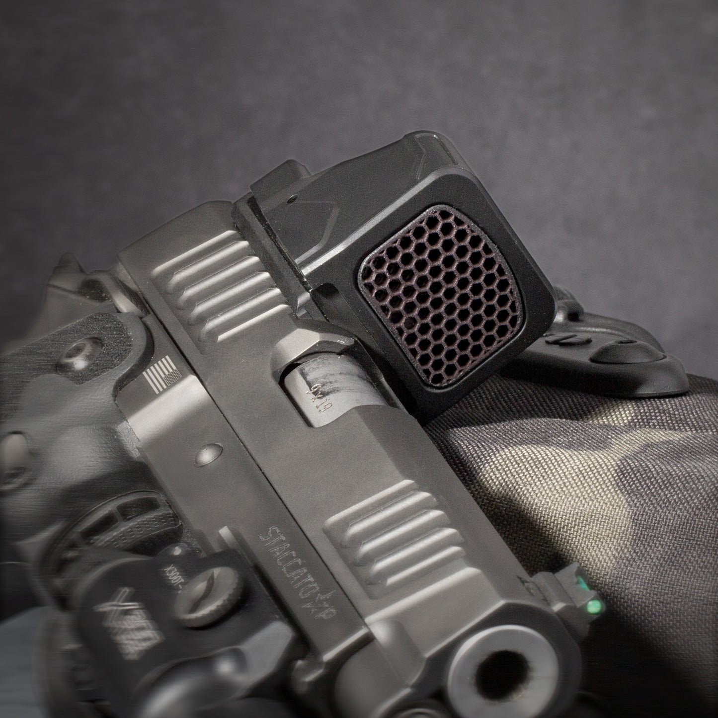 Black Optic Scope Cover with GlareGard Killflash Lens Installed for Holosun® 507 Comp - Laying on holster
