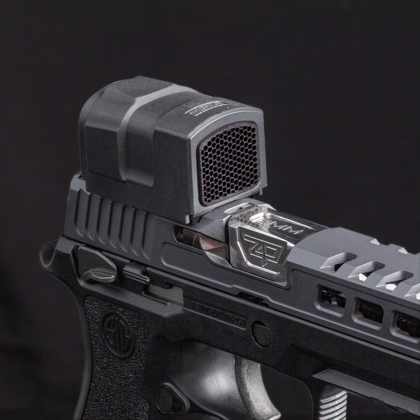Black Optic Scope Cover with GlareGard Killflash Lens Installed for Aimpoint® ACRO P-2 - Top view pointing to the right