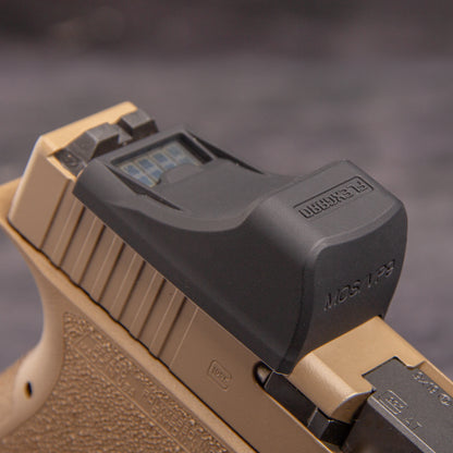 Close-up of a FlexGard Rubber Dust Cover for Holosun SCS MOS mounted on a FDE handgun [ads-hide]