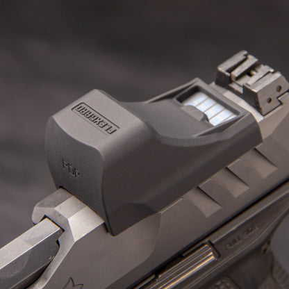 Close-up of a FlexGard Rubber Dust Cover for Holosun SCS PDP mounted on a handgun [ads-hide]