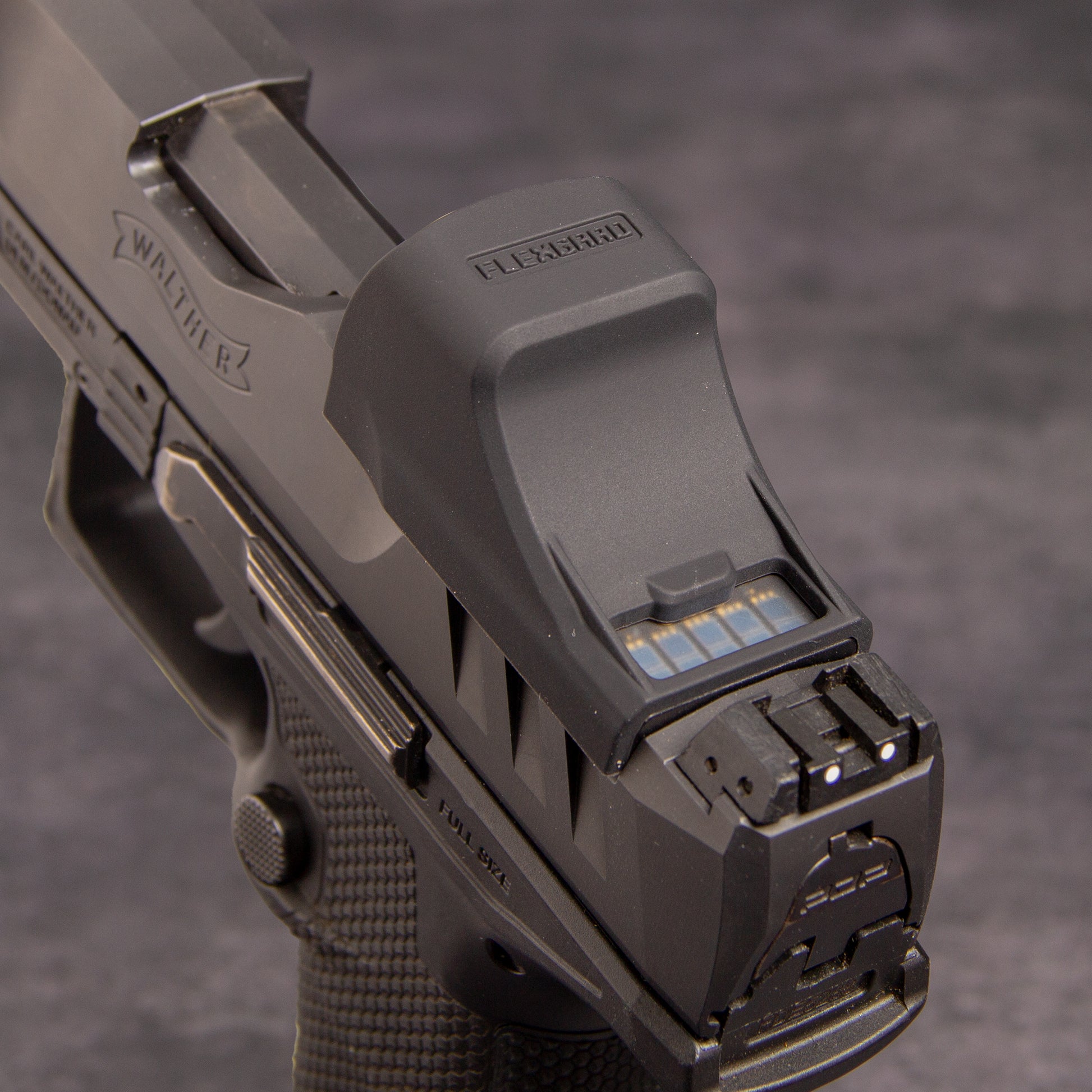 Close-up of a FlexGard Rubber Dust Cover for Holosun SCS PDP mounted on a handgun [ads-hide]