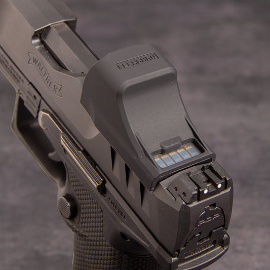 Close-up of a FlexGard Rubber Dust Cover for Holosun SCS PDP mounted on a handgun [ads-hide]