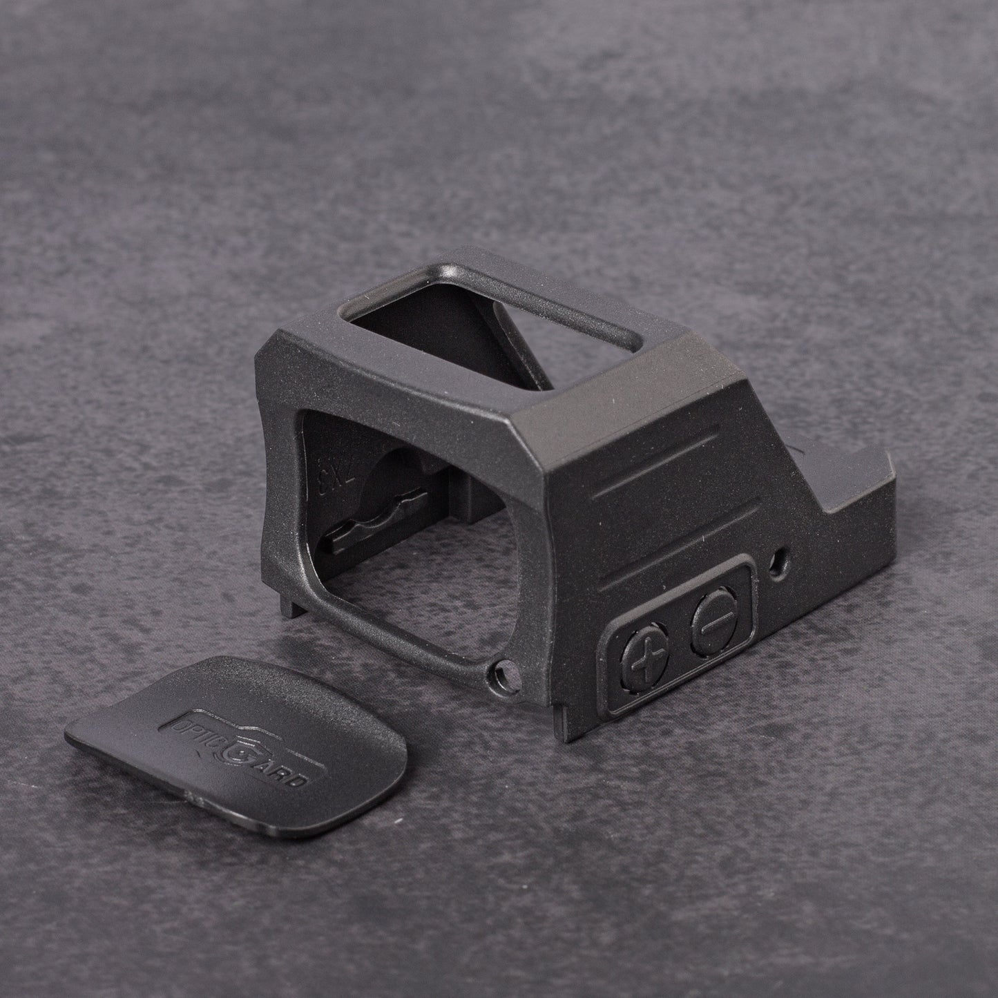 Black OpticGard Cover for Holosun 507CX3 on a gray textured background