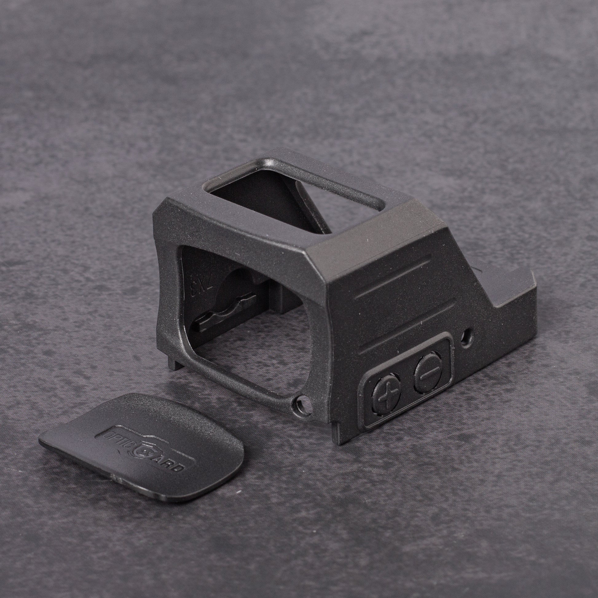 Black OpticGard Cover for Holosun 507CX3 on a gray textured background